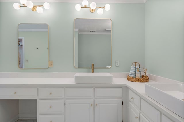 bathroom featuring visible vents, vanity, an inviting chandelier, and crown molding