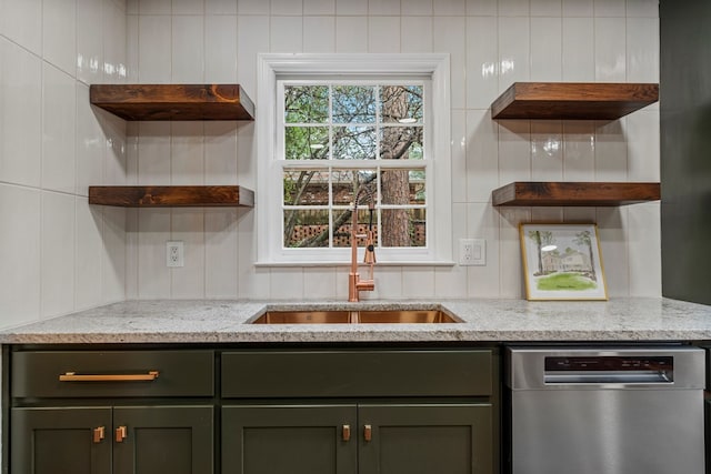 kitchen with green cabinetry, a sink, dishwasher, and open shelves