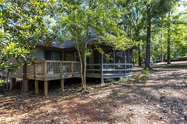 2231 Holly Ln, Pine Mountain, GA 31822 - back of house with a wooden deck, a sunroom, and a shingled roof