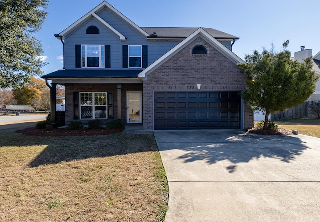 1 Cambridge Ct, Phenix City, AL 36870 - view of front of home with brick siding, concrete driveway, and a front yard
