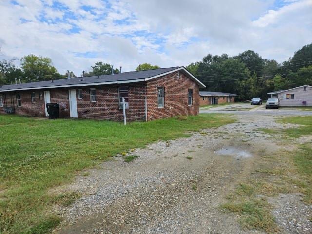 view of side of property with a yard