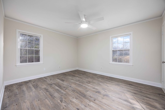 empty room featuring ceiling fan, ornamental molding, and hardwood / wood-style floors