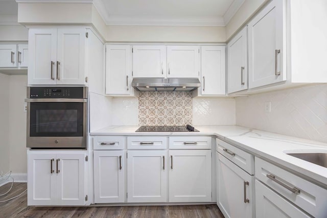 kitchen with white cabinets, light stone countertops, oven, and black electric cooktop