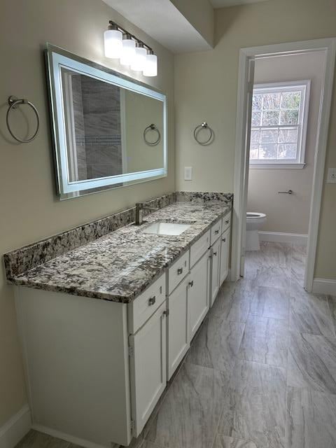 bathroom with vanity and toilet