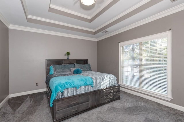 bedroom featuring a raised ceiling, crown molding, and carpet floors