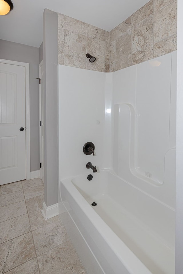 bathroom featuring  shower combination and tile patterned flooring