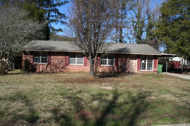 single story home featuring a front yard and a carport