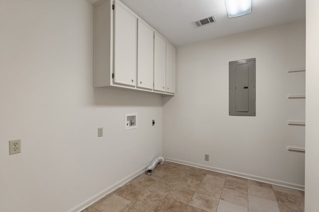 washroom with cabinets, washer hookup, hookup for an electric dryer, a textured ceiling, and electric panel