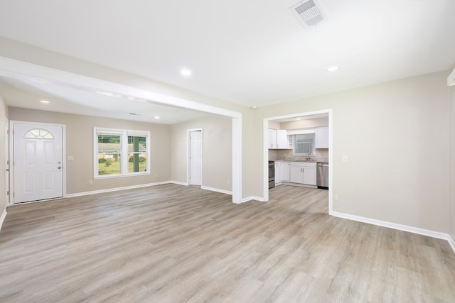 20 Benning Dell Dr, Columbus, GA 31903 - unfurnished living room with light wood-style floors and recessed lighting