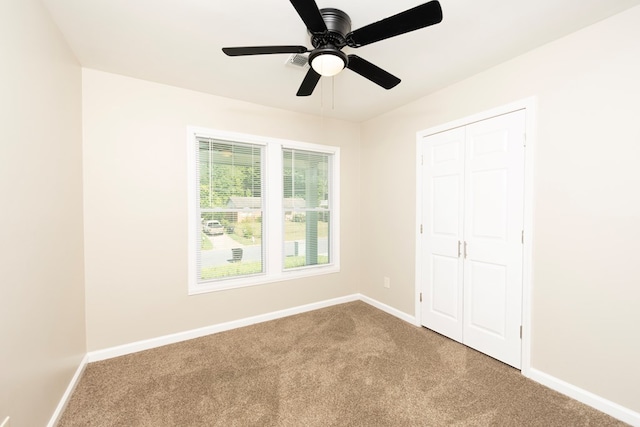20 Benning Dell Dr, Columbus, GA 31903 - unfurnished bedroom with carpet flooring, a closet, and a ceiling fan
