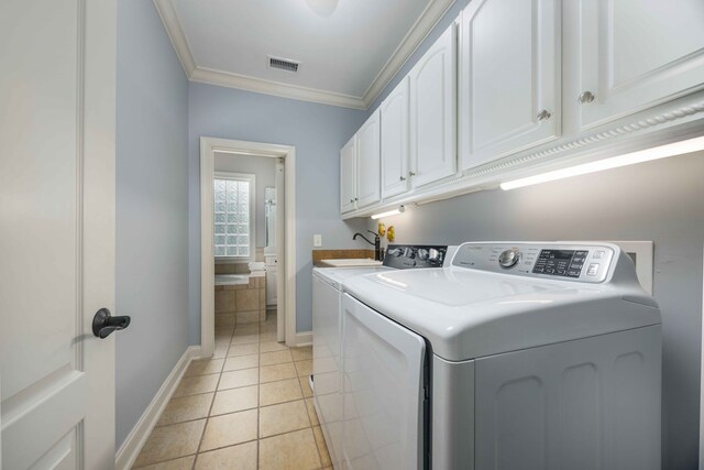 4730 Turnberry Ln Unit 15, Columbus, GA 31909 - laundry area with cabinet space, independent washer and dryer, ornamental molding, and light tile patterned floors