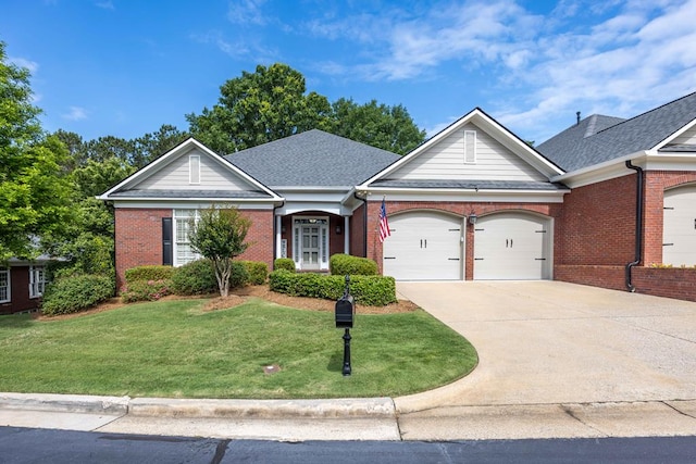 4730 Turnberry Ln Unit 15, Columbus, GA 31909 - view of front of home featuring an attached garage, brick siding, a front yard, and driveway