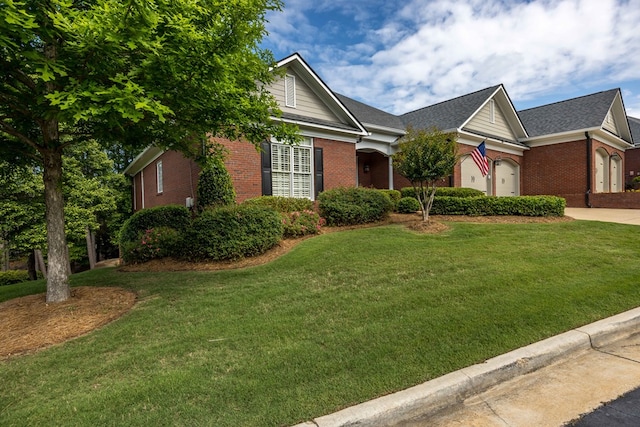 4730 Turnberry Ln Unit 15, Columbus, GA 31909 - view of front of house with brick siding, a front lawn, and driveway