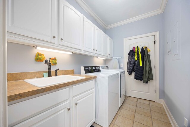 4730 Turnberry Ln Unit 15, Columbus, GA 31909 - washroom featuring washer and clothes dryer, cabinet space, crown molding, and light tile patterned floors