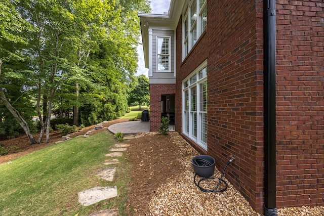 4730 Turnberry Ln Unit 15, Columbus, GA 31909 - view of property exterior with brick siding, a lawn, and a patio