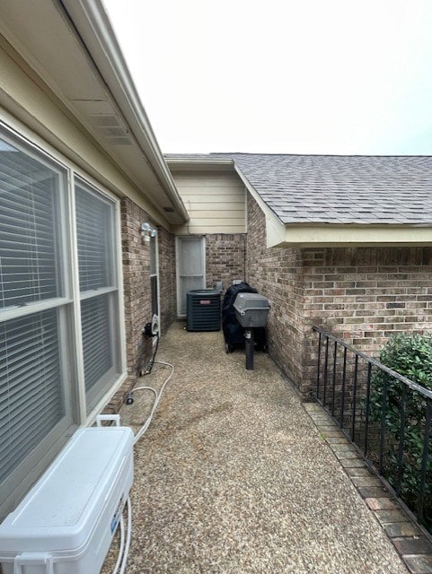 view of patio / terrace featuring central AC and a grill