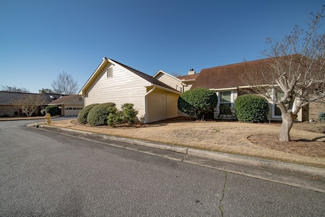 view of front of home featuring a chimney