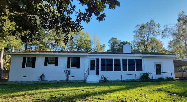 166 Pine Ridge Dr, Union Springs, AL 36089 - view of front of home featuring entry steps, a chimney, a front lawn, stucco siding, and crawl space