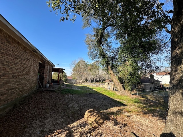 view of yard with fence