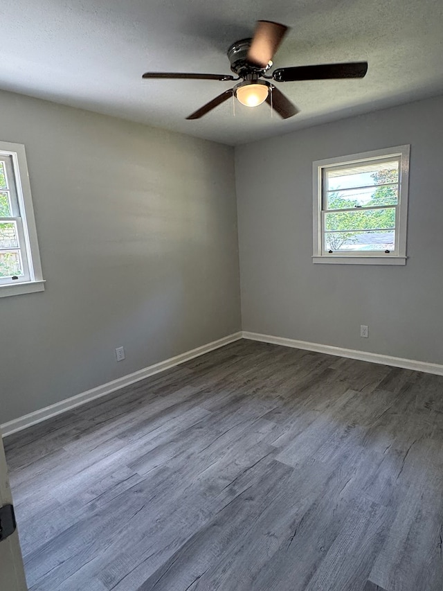 1508 Emerson Ave, Columbus, GA 31907 - empty room with dark wood-type flooring, ceiling fan, and a textured ceiling