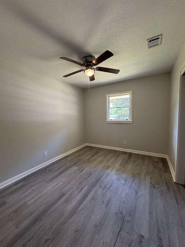 1508 Emerson Ave, Columbus, GA 31907 - spare room with dark wood finished floors, ceiling fan, and a textured ceiling