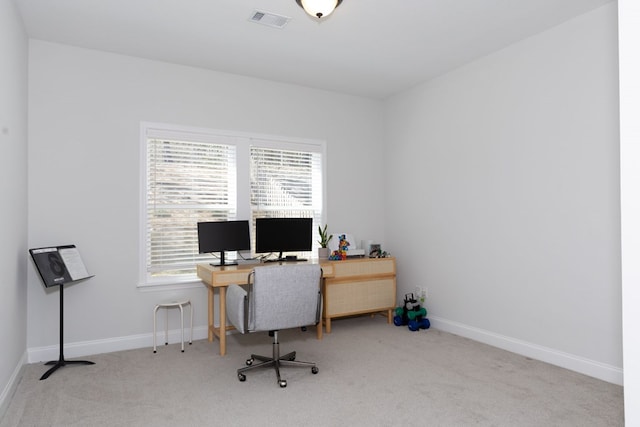 carpeted home office with visible vents and baseboards