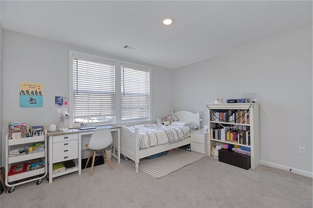 carpeted bedroom featuring baseboards and visible vents