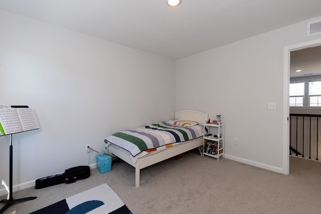 bedroom featuring visible vents, baseboards, and carpet floors