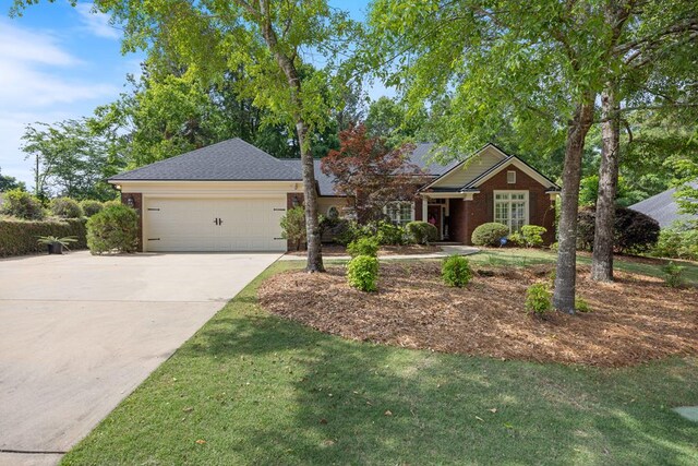 1018 Annbriar Ln, Columbus, GA 31909 - view of front of home featuring driveway, a garage, and a front yard