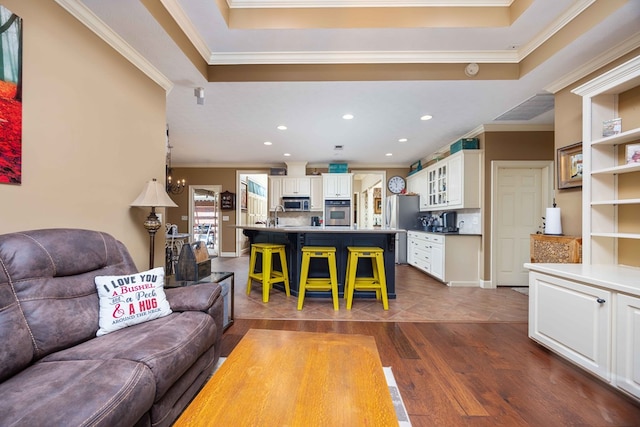 living room featuring crown molding, recessed lighting, and dark wood-style flooring