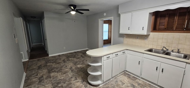 1526 Barcelona Dr, Columbus, GA 31907 - kitchen featuring open shelves, a sink, tasteful backsplash, and stone finish flooring