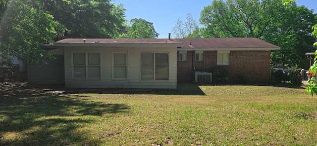 1526 Barcelona Dr, Columbus, GA 31907 - back of property with brick siding, a yard, and central AC unit