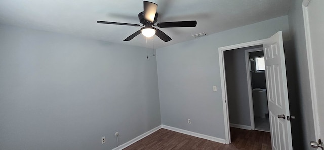 1526 Barcelona Dr, Columbus, GA 31907 - unfurnished bedroom with ceiling fan, baseboards, dark wood-style flooring, and visible vents