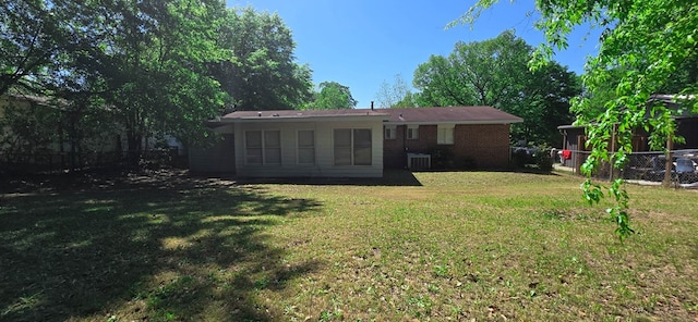 1526 Barcelona Dr, Columbus, GA 31907 - rear view of house featuring central AC unit, fence, and a yard