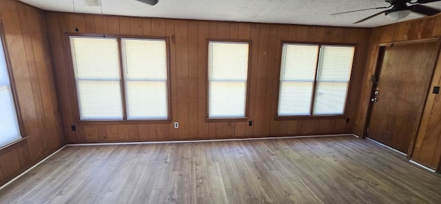 1526 Barcelona Dr, Columbus, GA 31907 - empty room with wood walls, wood finished floors, and ceiling fan