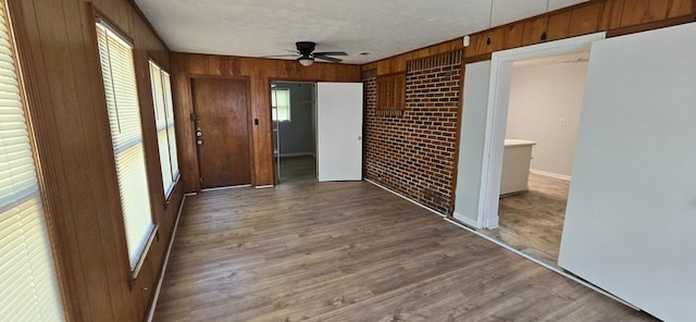 1526 Barcelona Dr, Columbus, GA 31907 - hallway featuring wood walls, baseboards, wood finished floors, and a textured ceiling