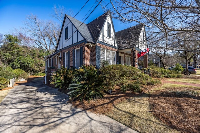 view of property exterior with brick siding