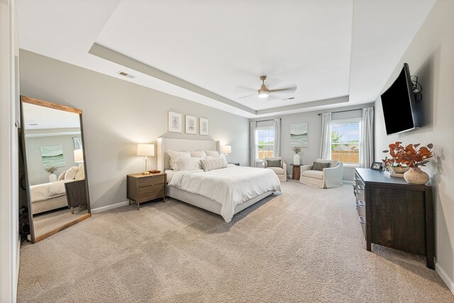 2013 Hereford Ln, Columbus, GA 31904 - bedroom featuring a raised ceiling, light carpet, and a ceiling fan