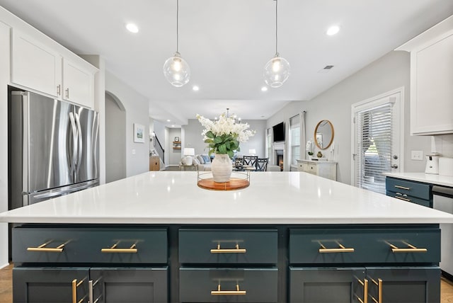 2013 Hereford Ln, Columbus, GA 31904 - kitchen with white cabinets, freestanding refrigerator, recessed lighting, light countertops, and open floor plan