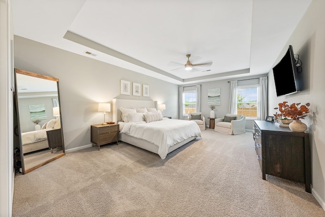 2013 Hereford Ln, Columbus, GA 31904 - bedroom with a raised ceiling, light carpet, baseboards, and ceiling fan