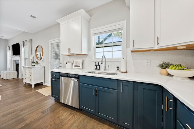 2013 Hereford Ln, Columbus, GA 31904 - kitchen featuring dishwasher, blue cabinetry, a sink, dark wood-style floors, and white cabinetry