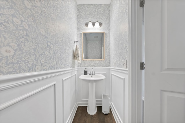 2013 Hereford Ln, Columbus, GA 31904 - bathroom with a decorative wall, a wainscoted wall, wood finished floors, and wallpapered walls