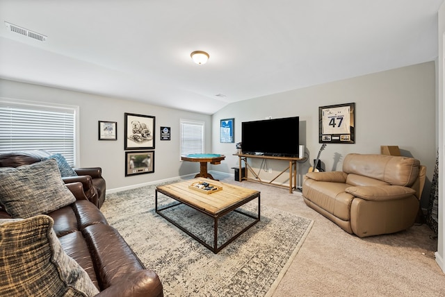 2013 Hereford Ln, Columbus, GA 31904 - living room featuring light colored carpet, vaulted ceiling, and baseboards
