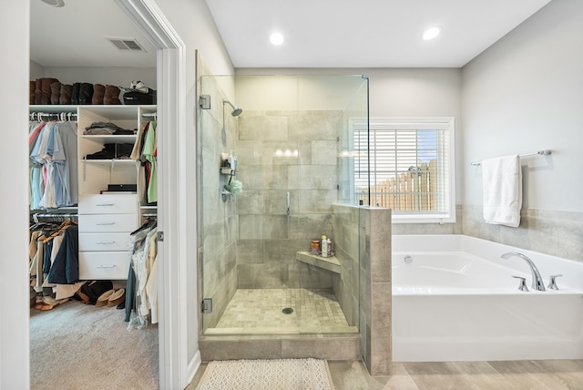 2013 Hereford Ln, Columbus, GA 31904 - bathroom featuring a garden tub, a shower stall, a walk in closet, and recessed lighting