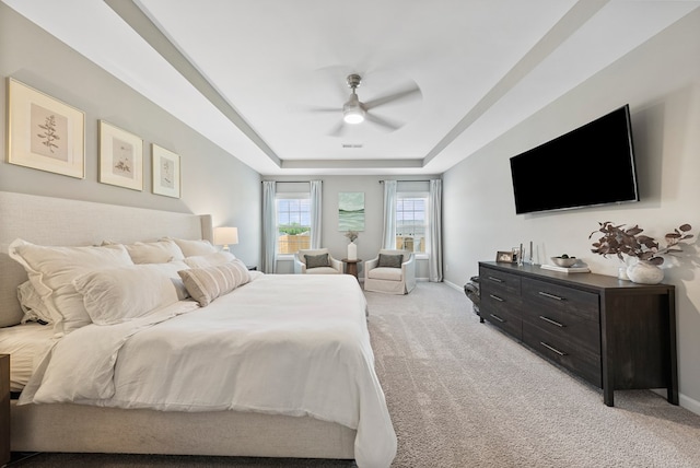 2013 Hereford Ln, Columbus, GA 31904 - bedroom featuring light carpet, a raised ceiling, baseboards, and a ceiling fan