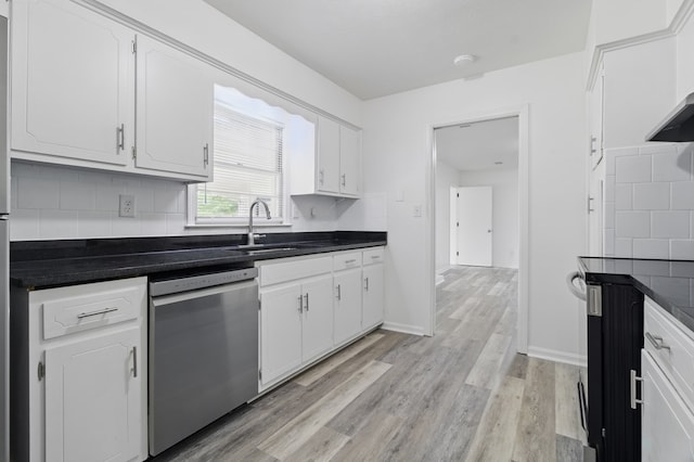 5202 Lakeshore Rd, Columbus, GA 31907 - kitchen featuring dishwasher, a sink, and white cabinets
