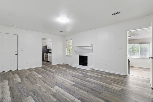 5202 Lakeshore Rd, Columbus, GA 31907 - unfurnished living room with wood finished floors, baseboards, a fireplace, and ornamental molding