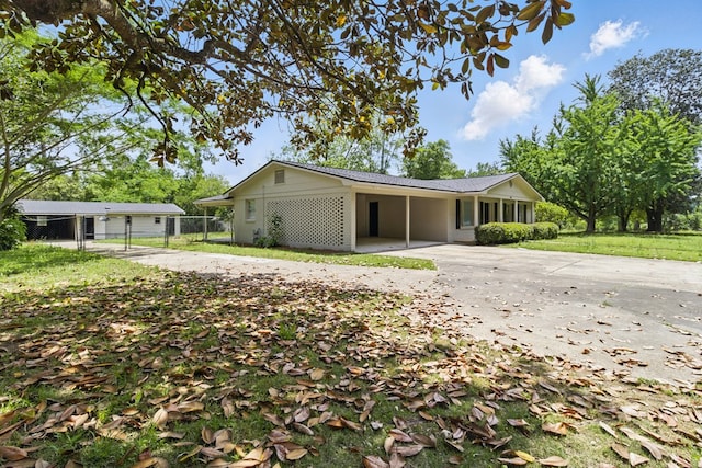 5202 Lakeshore Rd, Columbus, GA 31907 - single story home with driveway and a carport