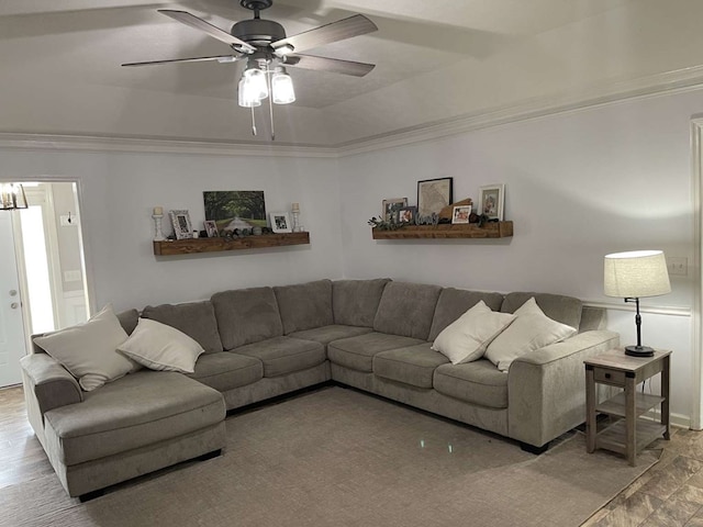 living room featuring ceiling fan and ornamental molding