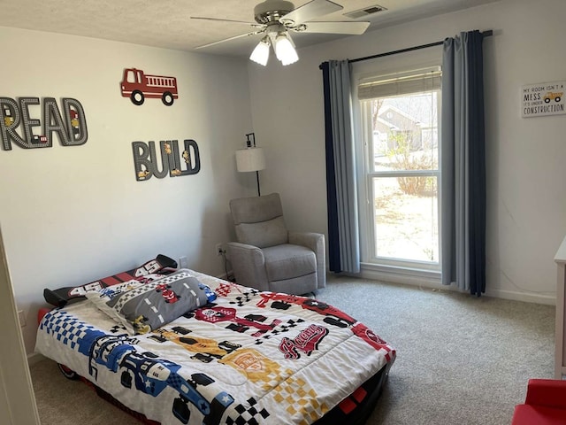 carpeted bedroom with ceiling fan